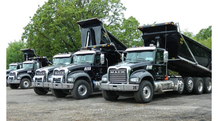 fleet of dump and hauling trucks 